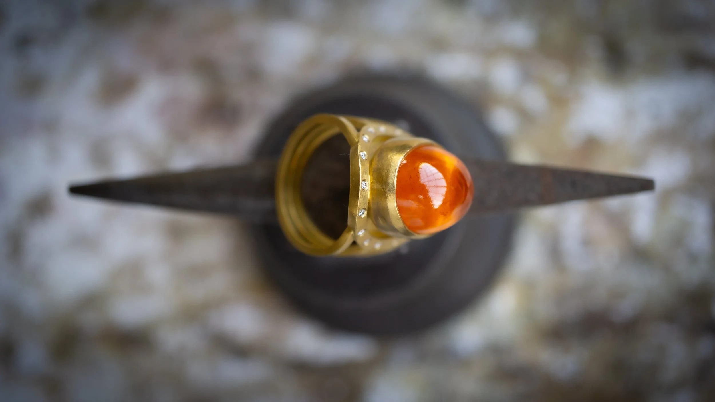 Aurora Ring on jeweler's anvil.