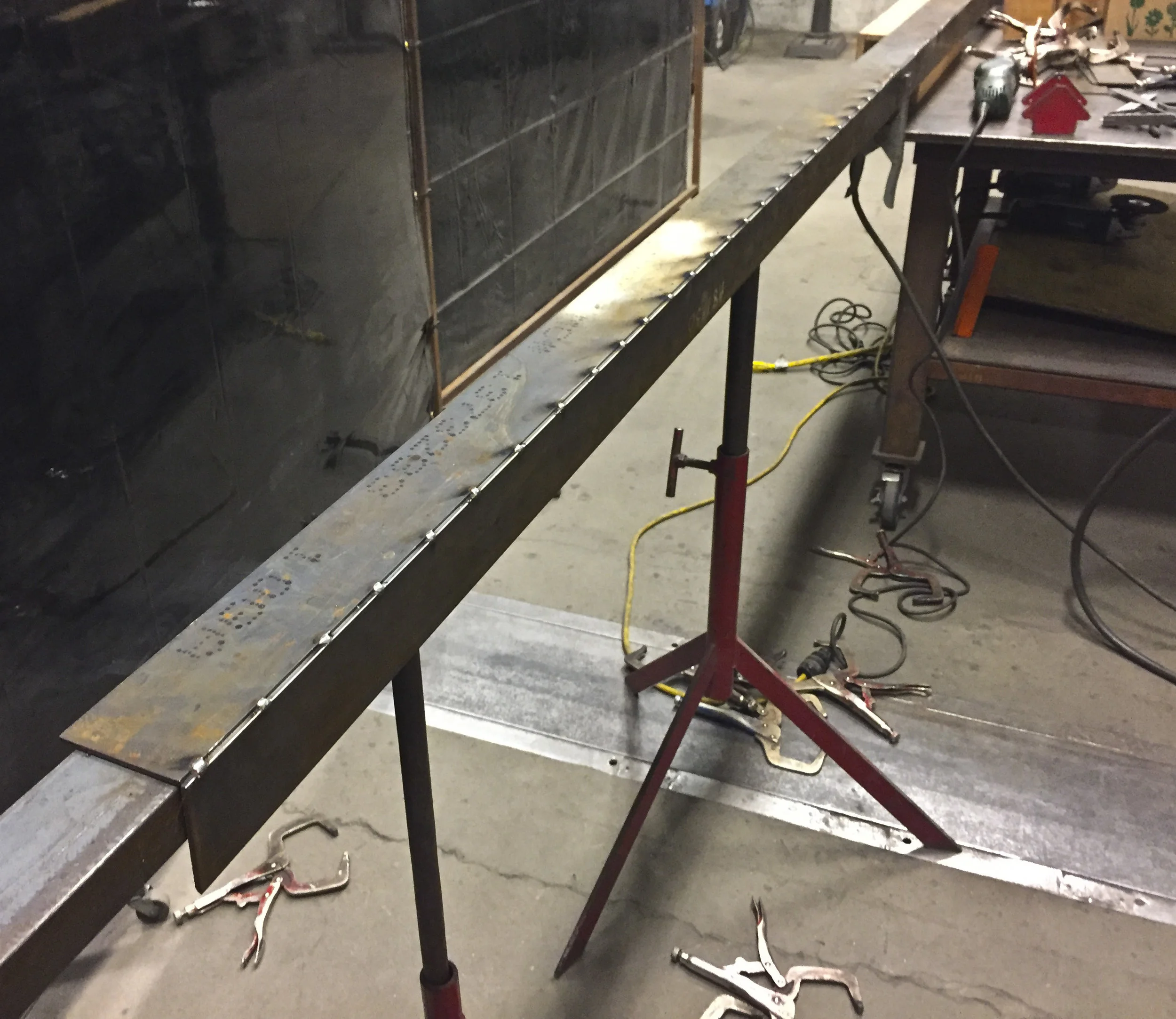 Tacking every 2" to maintain flat planes and minimize any heat distortion
