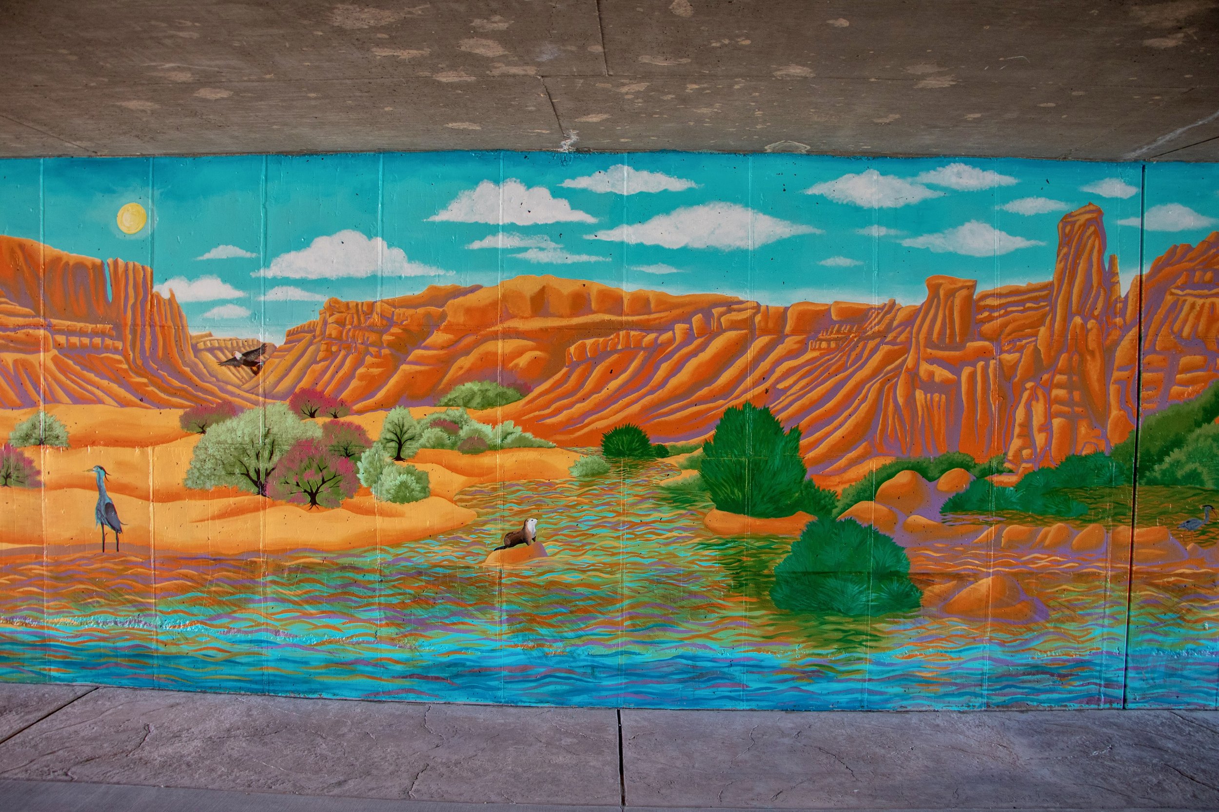  The mural then moves into the heat of the day, showing the passage of time. The piece is performative - as the viewer moves through the tunnel they act out our human effect on the environment, and the river and surrounding landscape begin to degrade