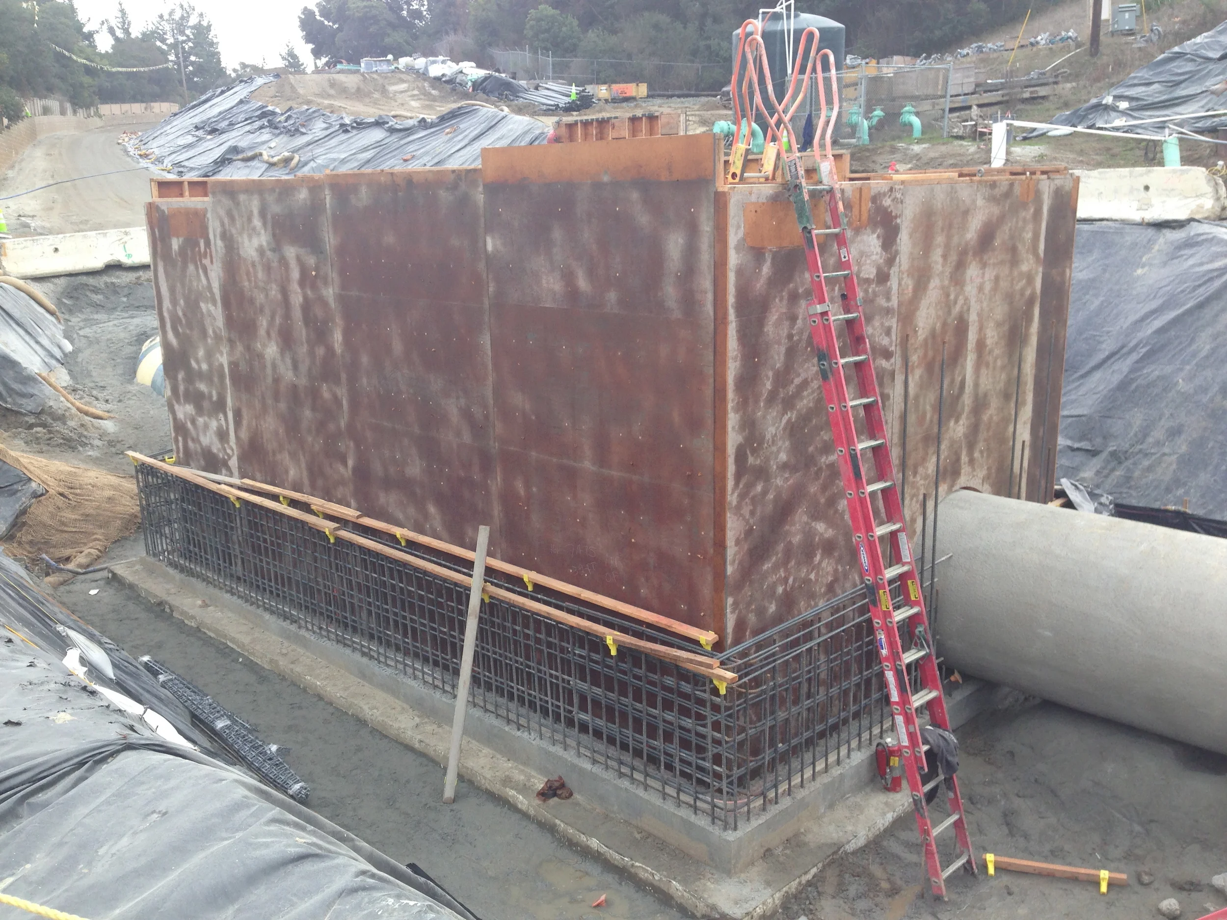 This wall rebar and formwork is in place for a new vault for the Venturi meter. The meter uses a converging section of pipe converging section of pipe to give an increase in the flow velocity and a corresponding pressure drop from which the flow rate can be calculated.