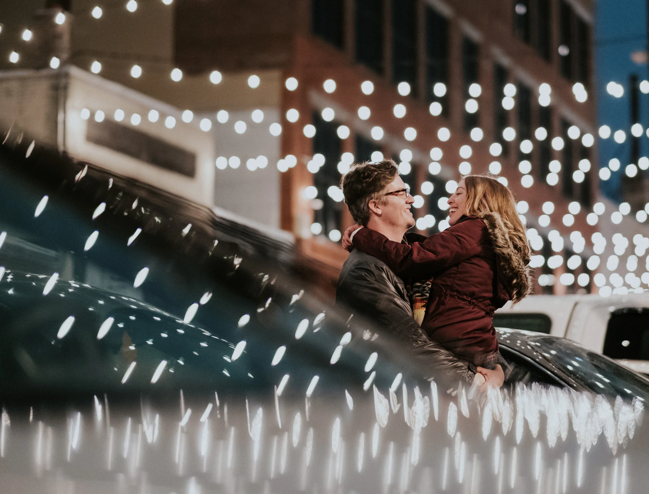  Downtown winter holiday engagement session in Flint, MI by Pop Mod Photo wedding photographers Ryan Garza and Courtney Simpson. 