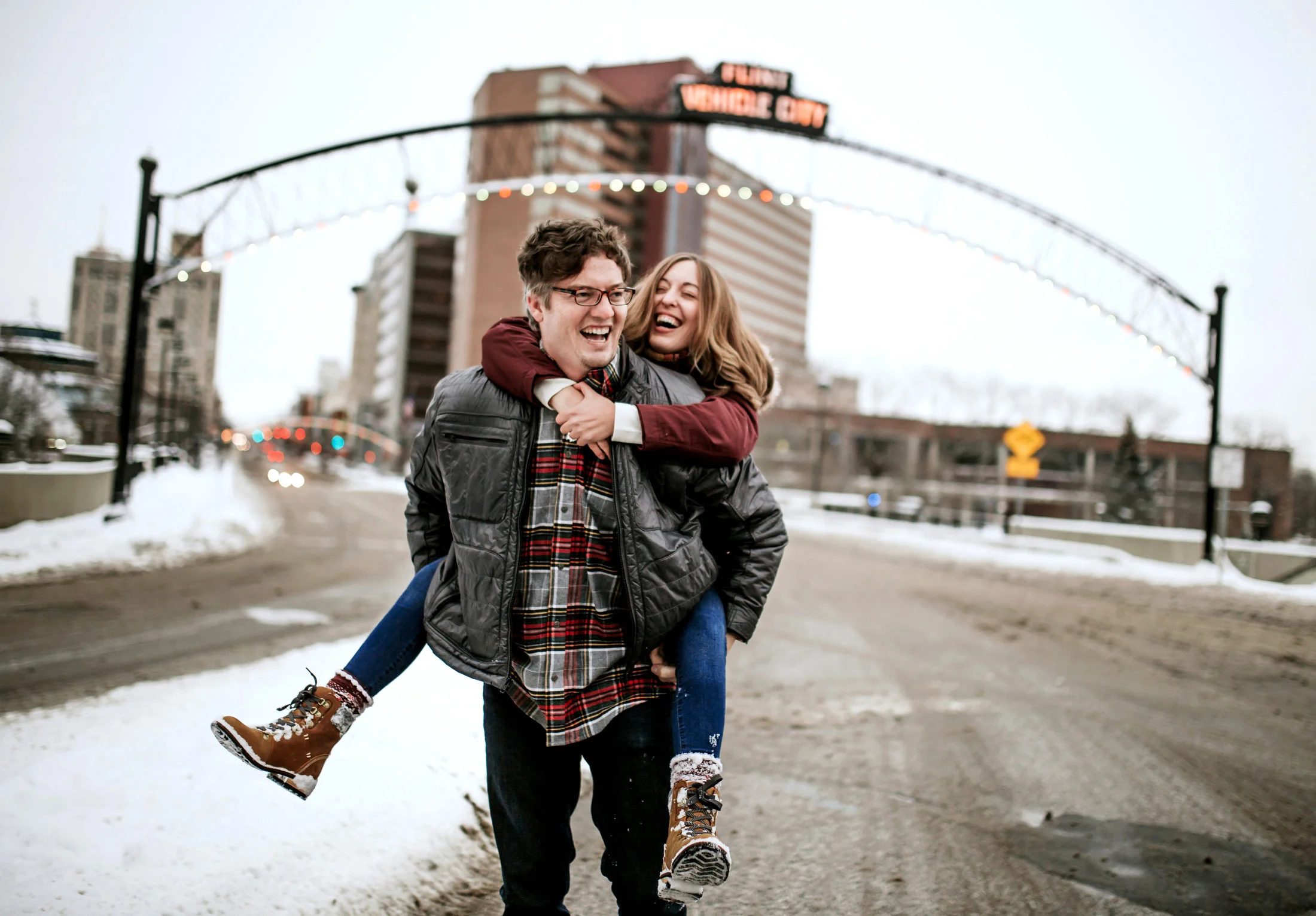  Downtown winter holiday engagement session in Flint, MI by Pop Mod Photo wedding photographers Ryan Garza and Courtney Simpson. 