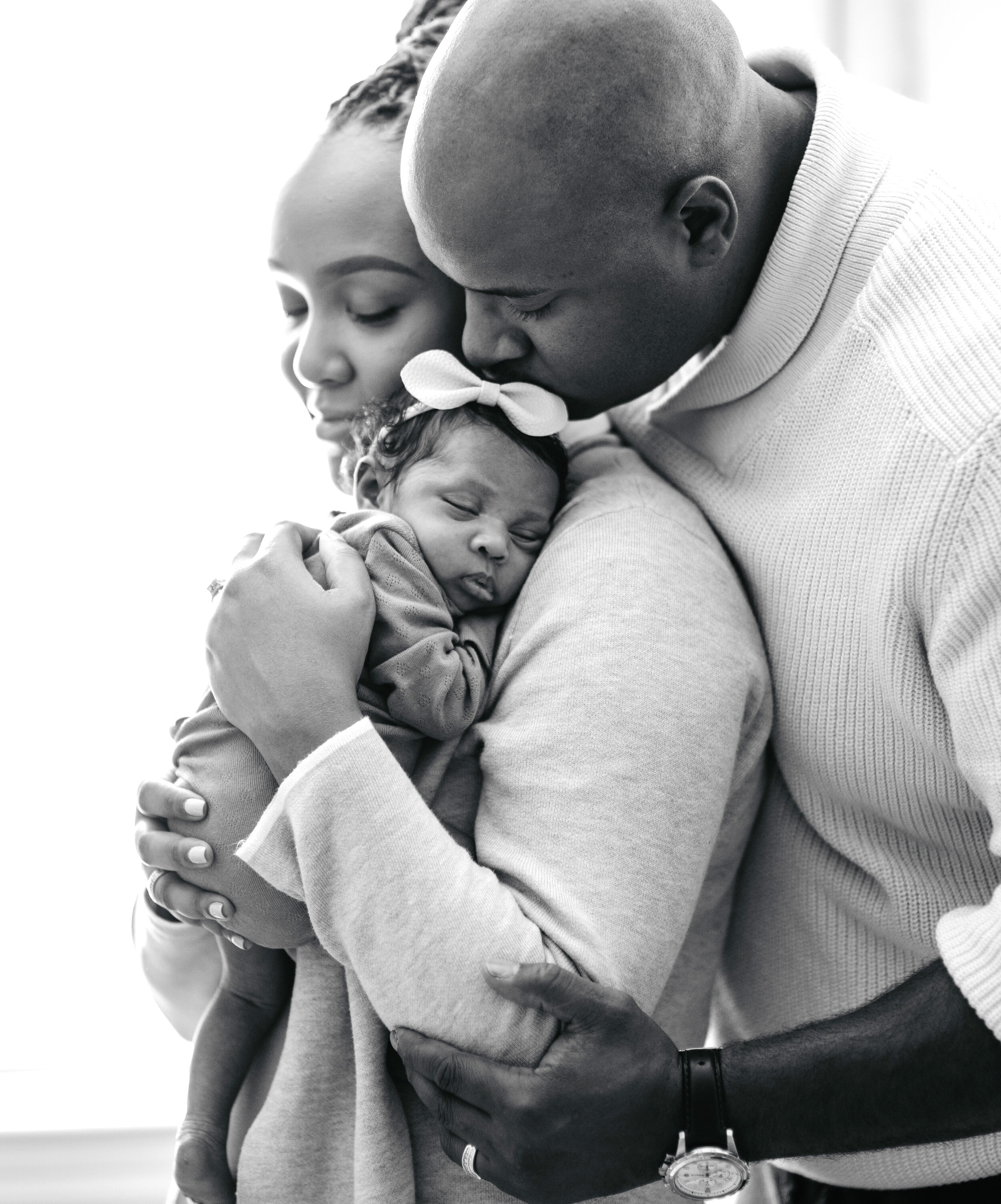  At home newborn session in Flint, Michigan by Pop Mod Photo photographers Ryan Garza and Courtney Simpson. 