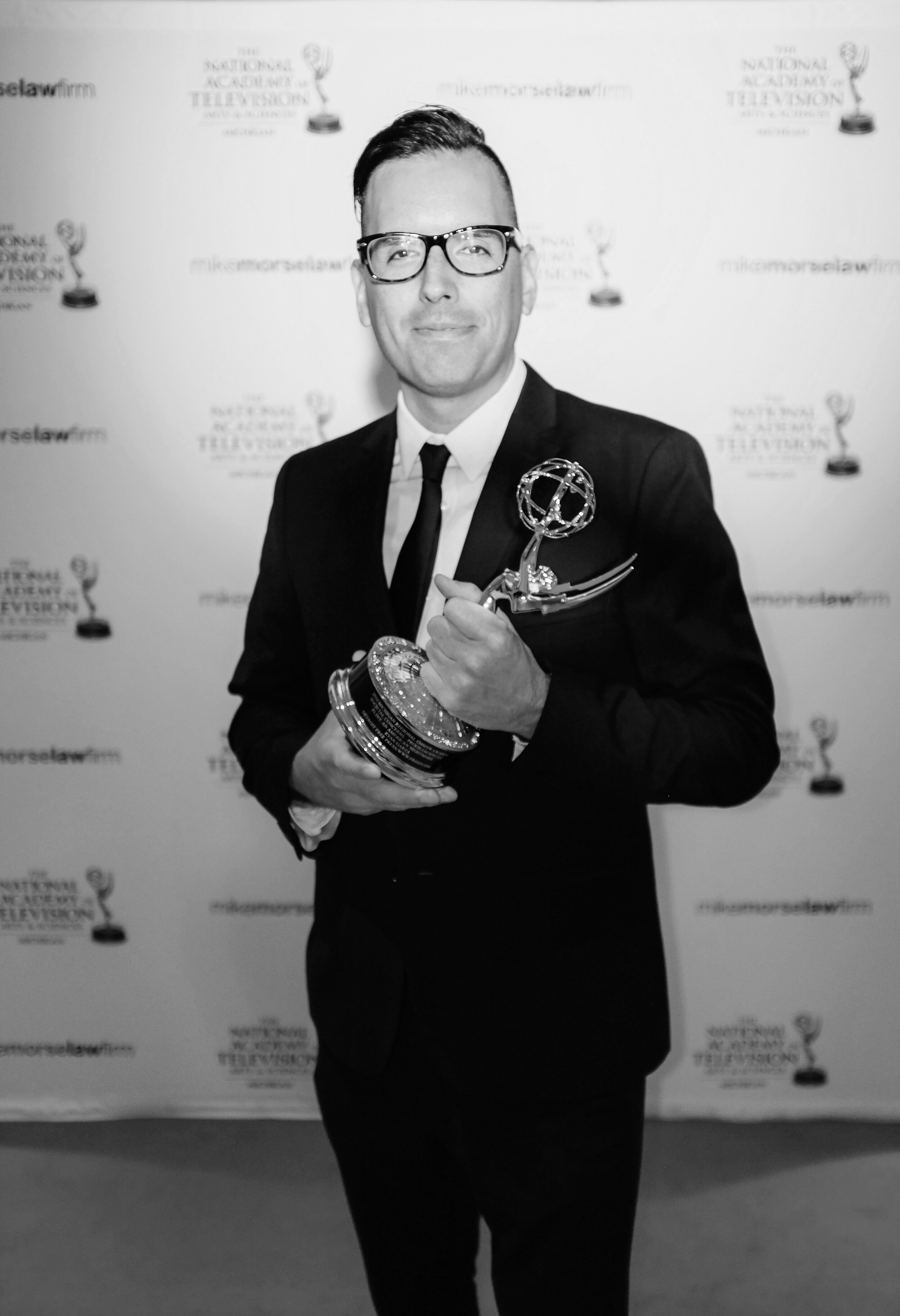  Pop Mod Photo co-owner Ryan Garza stands with his EMMY after short documentary covering the Flint Water Crisis for the Detroit Free Press was awarded that he worked on with fellow Detroit Free Press photographer Brian Kaufman. 