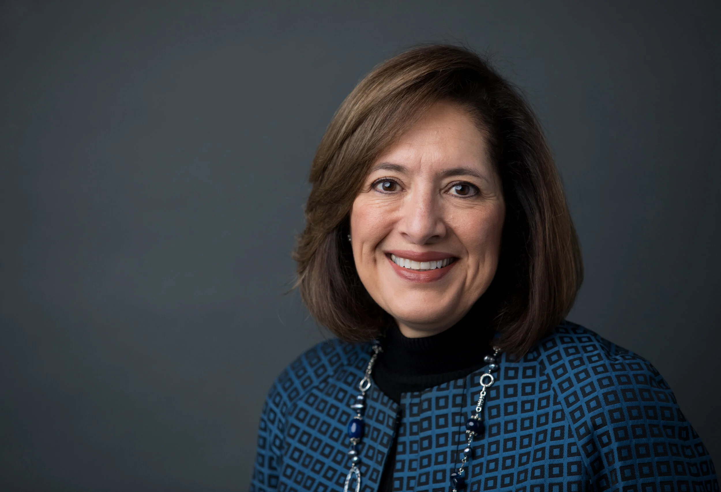  Ruth Mott Foundation President Raquel Thueme poses for a photo during an in studio headshot photo session in downtown Flint, Michigan by Pop Mod Photo photographers Ryan Garza and Courtney Simpson. 