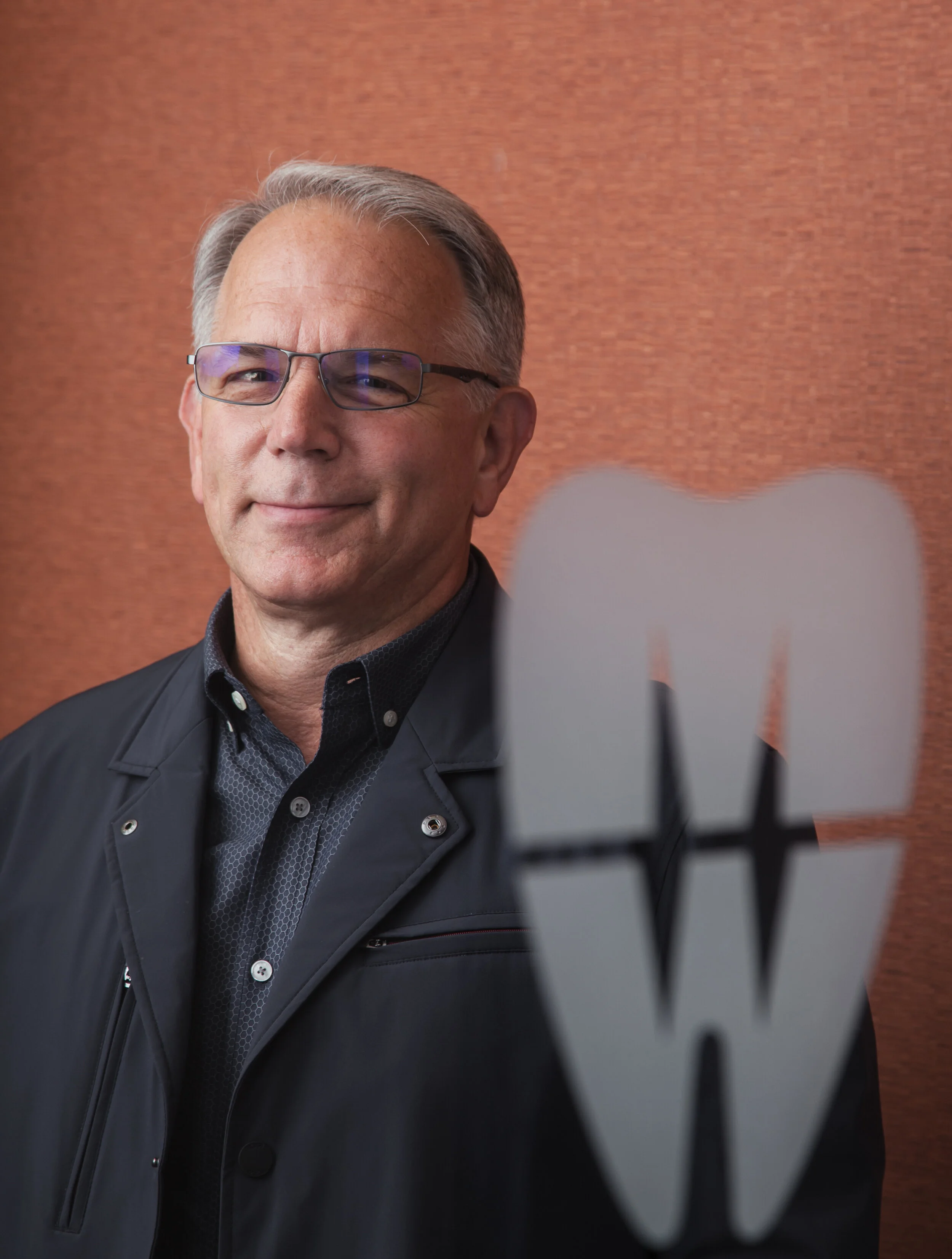  Dr. Martin Werschky family dentistry on location headshot photo session in downtown Flint, Michigan by Pop Mod Photo photographers Ryan Garza and Courtney Simpson. 