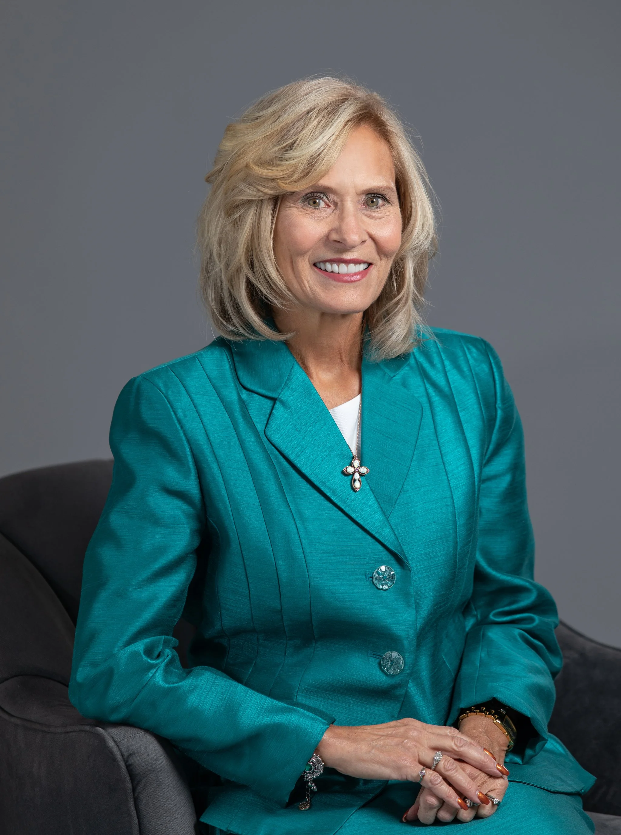  In Studio business headshot photo session of ELGA Credit Union CEO, Karen Church. ELGA Credit Union executives photographed in downtown Flint, Michigan by Pop Mod Photo photographers Courtney Simpson and Ryan Garza. 