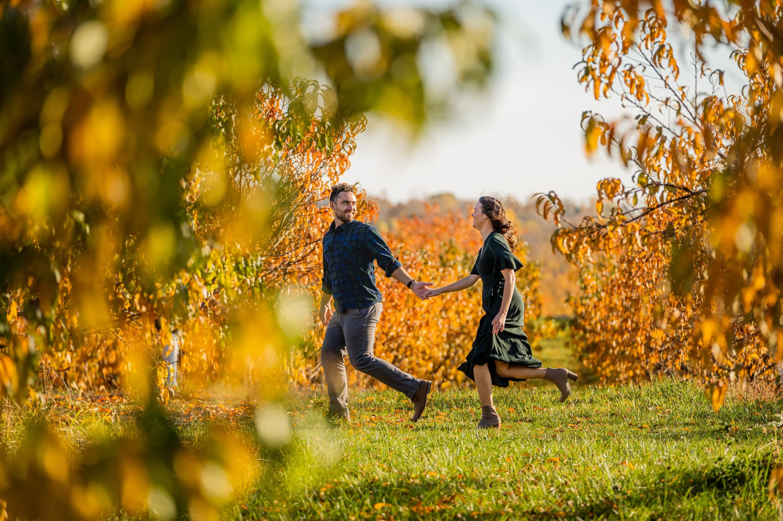  Fall color Michigan engagement session of Megan and Joe at Spicer Orchards Farm in Fenton, Michigan by Pop Mod Photo wedding photographers Ryan Garza and Courtney Simpson.  