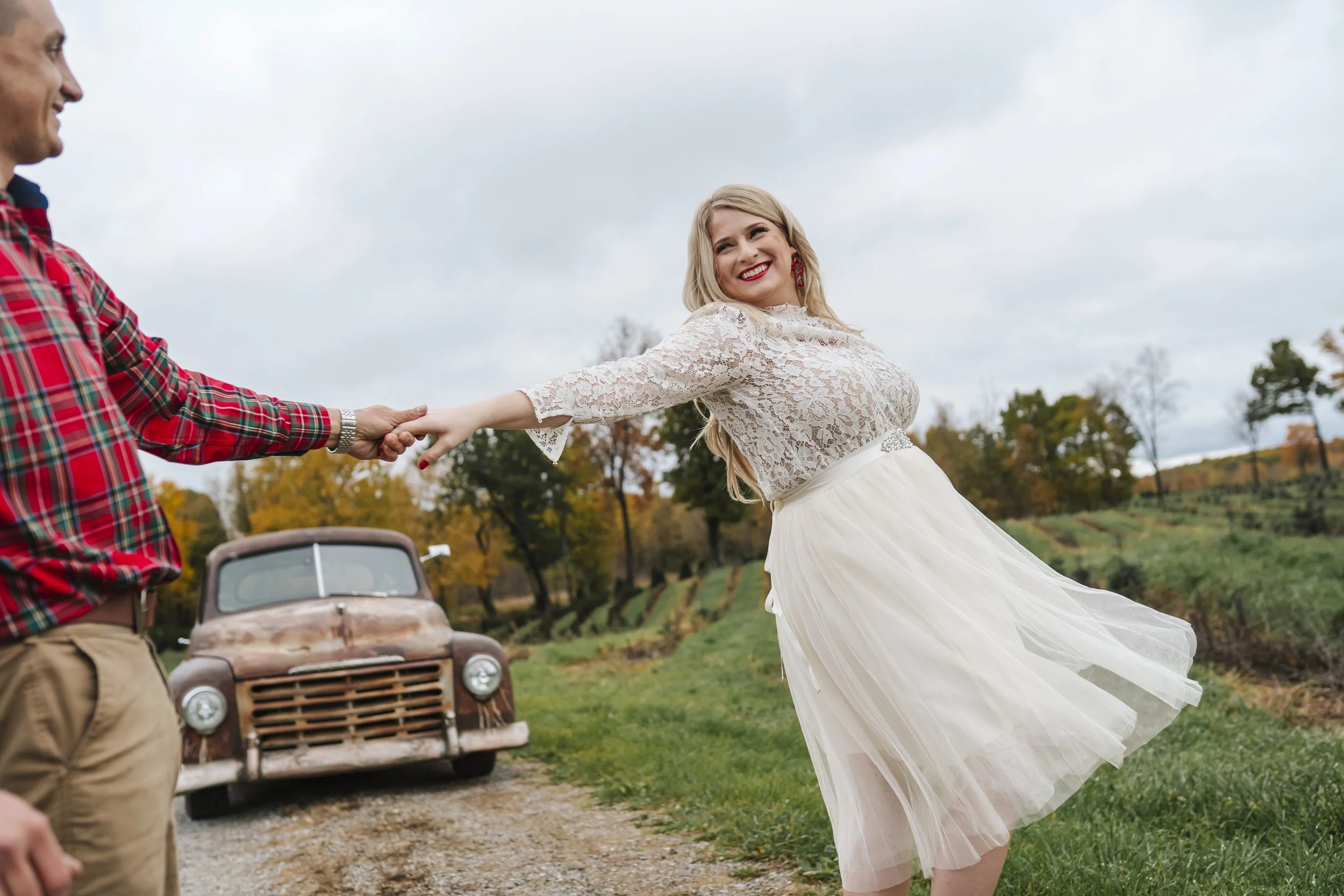  Melissa and Michael went to Top Hill Farms christmas tree farm in Goodrich, Michigan for a fall holiday themed engagement photo session with Pop Mod Photo wedding photographers Ryan Garza and Courtney Simpson before heading to downtown Flint, Michig