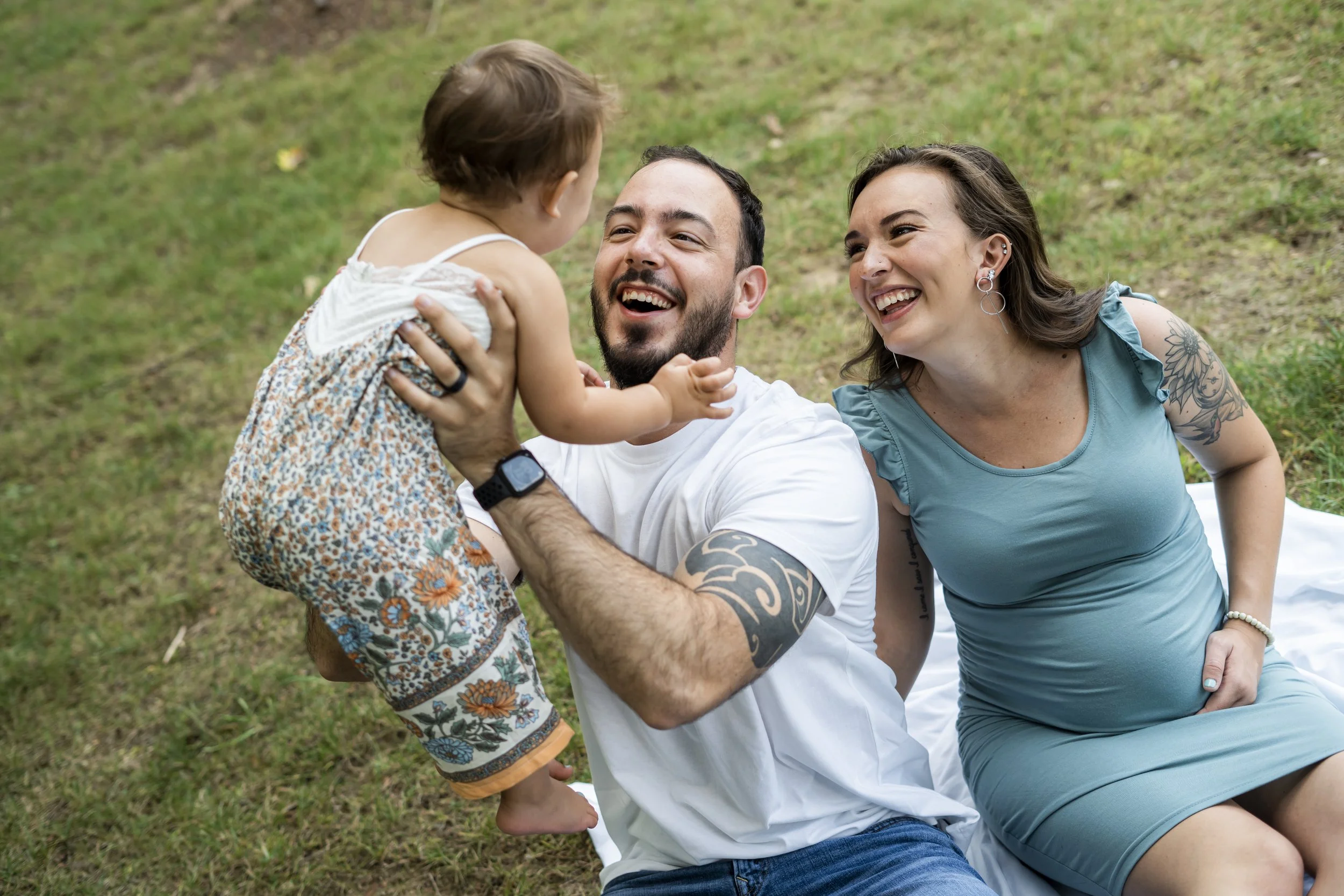  Erin and Brendon did a pregnancy family session at a wooded park in Davison, Michigan with Pop Mod Photo family photographers Ryan Garza and Courtney Simpson while preparing to add a new child to their family. 