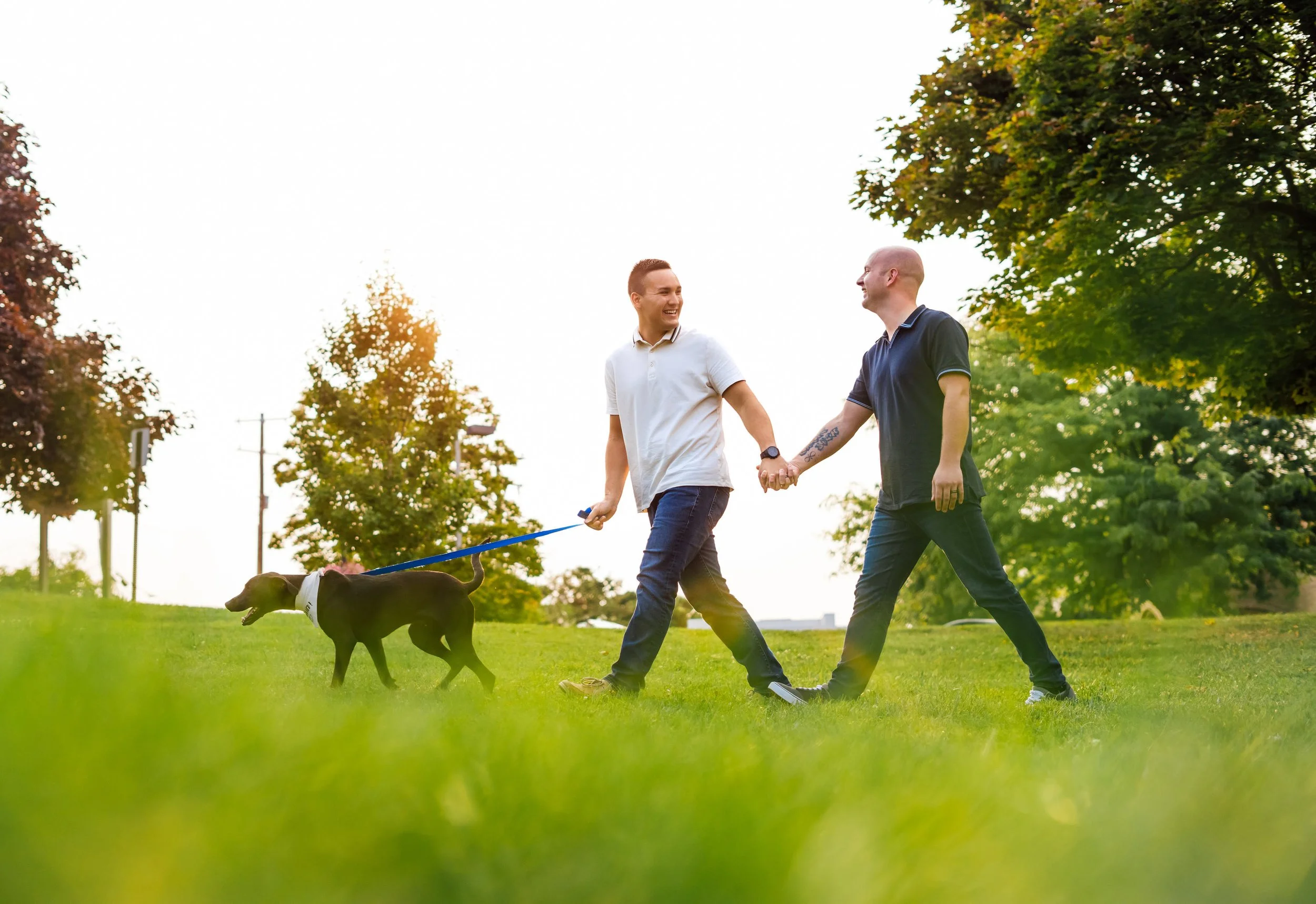  Nate and Skyler met up with Pop Mod Photo wedding photographers Ryan Garza and Courtney Simpson for a downtown summer engagement session in downtown Fenton, Michigan with their dog Rupert. The couple later traveled to Tenacity Brewery in Flint, Mich