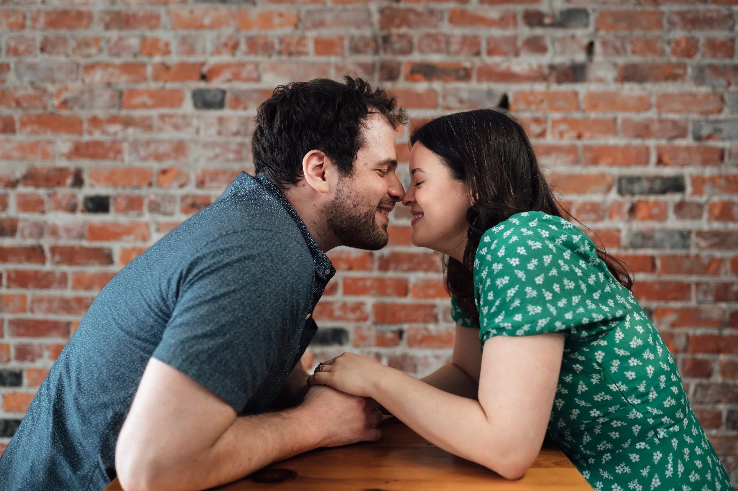  In studio Michigan engagement session of Kaitlin and Jordan at by Pop Mod Photo wedding photographers Ryan Garza and Courtney Simpson at their studio in downtown Flint, Michigan. 