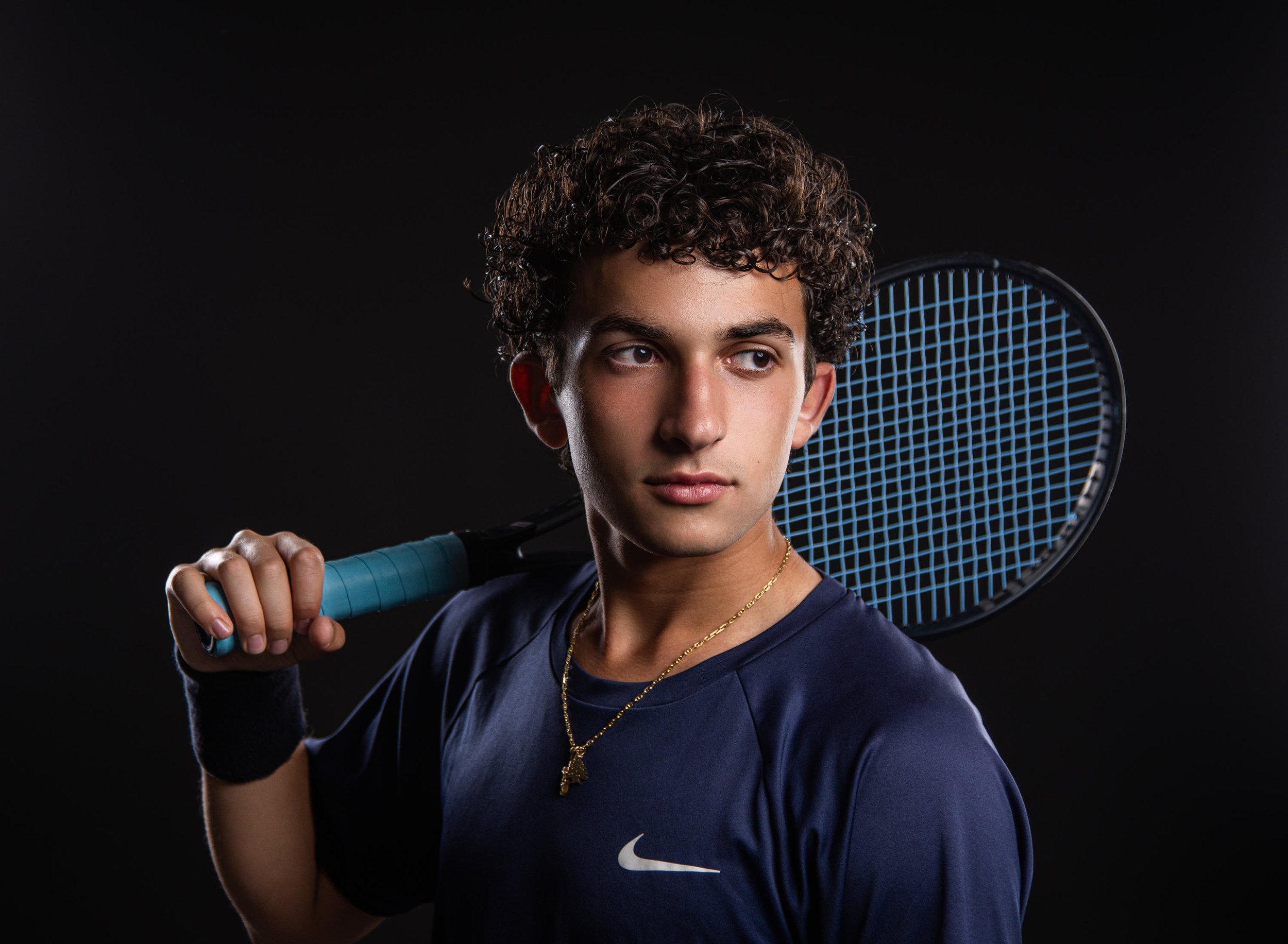  Flint Powers Catholic High School senior Jonah held his in studio senior photo session with Pop Mod Photo in downtown Flint, Michigan photographed by Ryan Garza and Courtney Simpson before heading for his sunset action tennis photos at the Flushing 