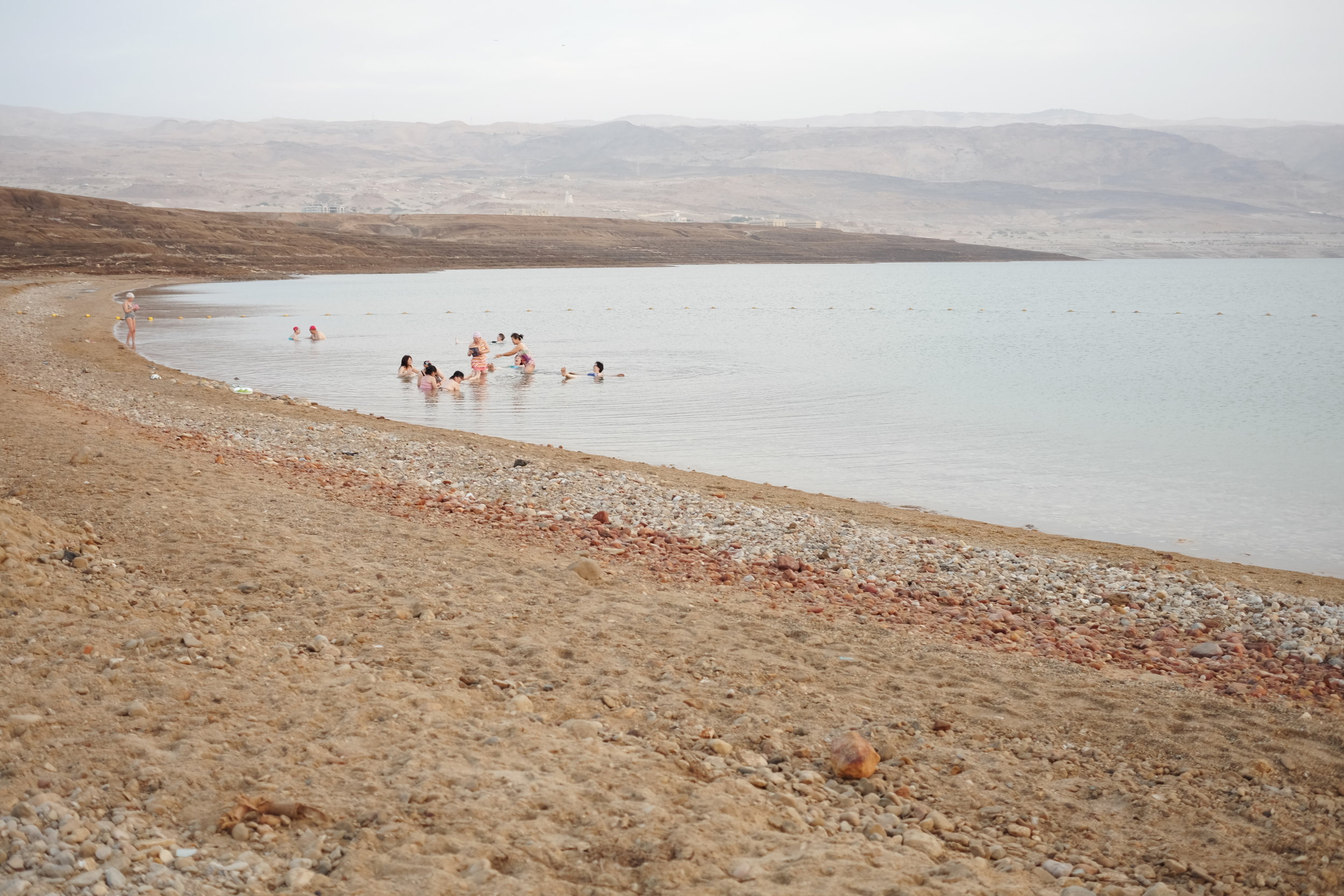 Chinese tourists floating in the Dead Sea