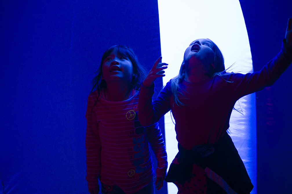  At the Pittsburgh Cultural Trust's Children's Festival, two young girls admire the wonders of the Luminarium, essentially an over-sized balloon made for people to explore.&nbsp; 