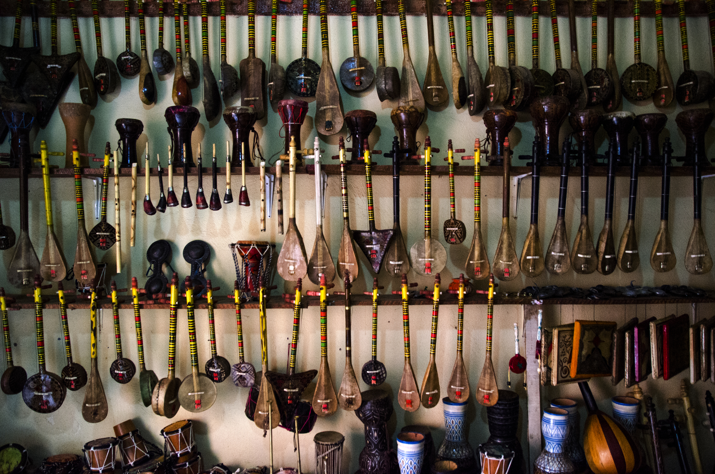  Various indigenous instruments hang in a small shop within the larger Government Shops in the old city, or Medina, of Marrakech, Morocco.&nbsp; 