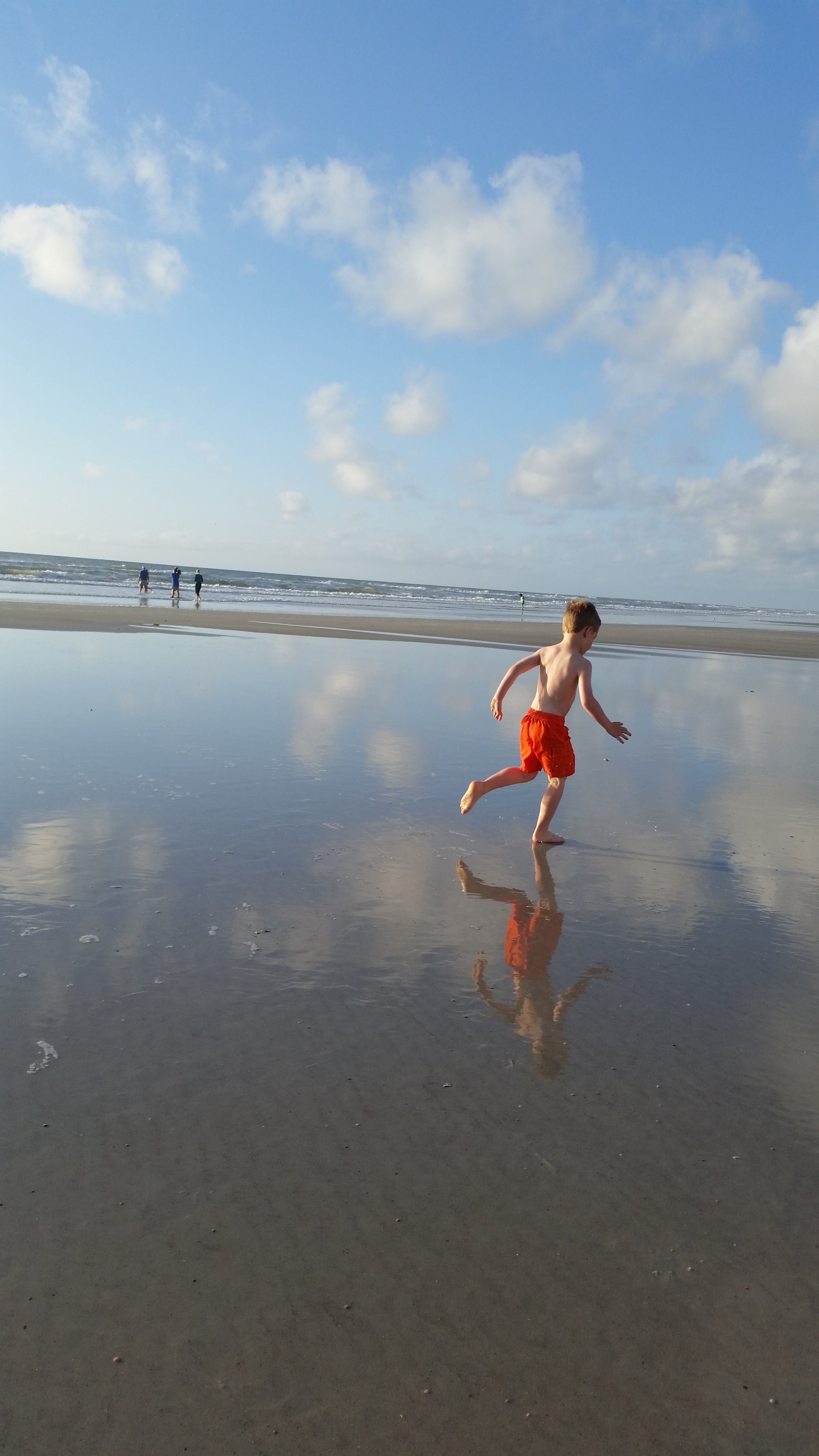 The reflections on the wet sand was so captivating; I definitely want to incorporate that into future paintings. Calvin is having a blast running and playing, unknowingly modeling for me. :-) He and Bryan joined me in Jacksonville, but flew home after the wedding. 