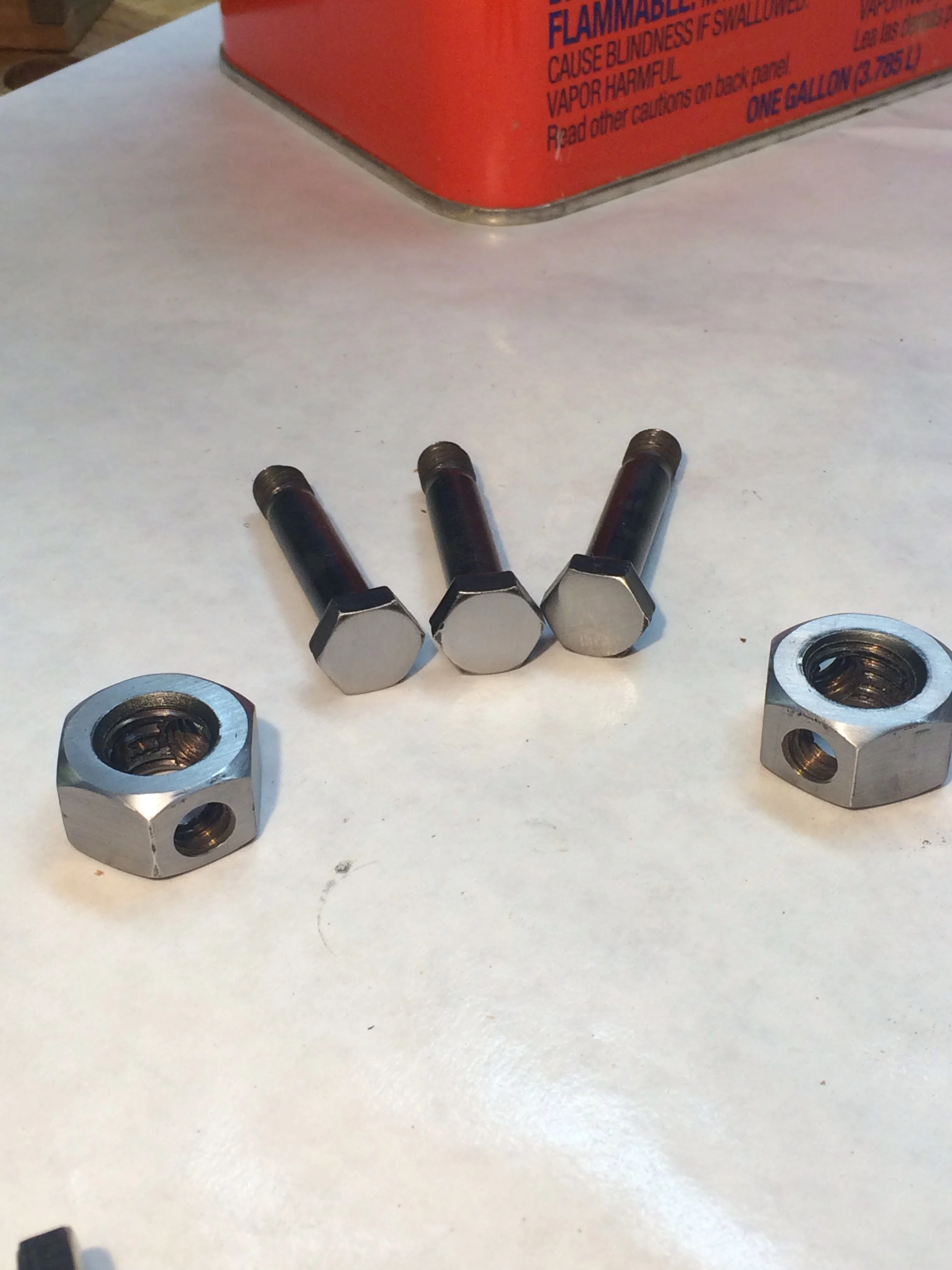 Tri-bolt hardware after being "dressed" with a smooth mill file