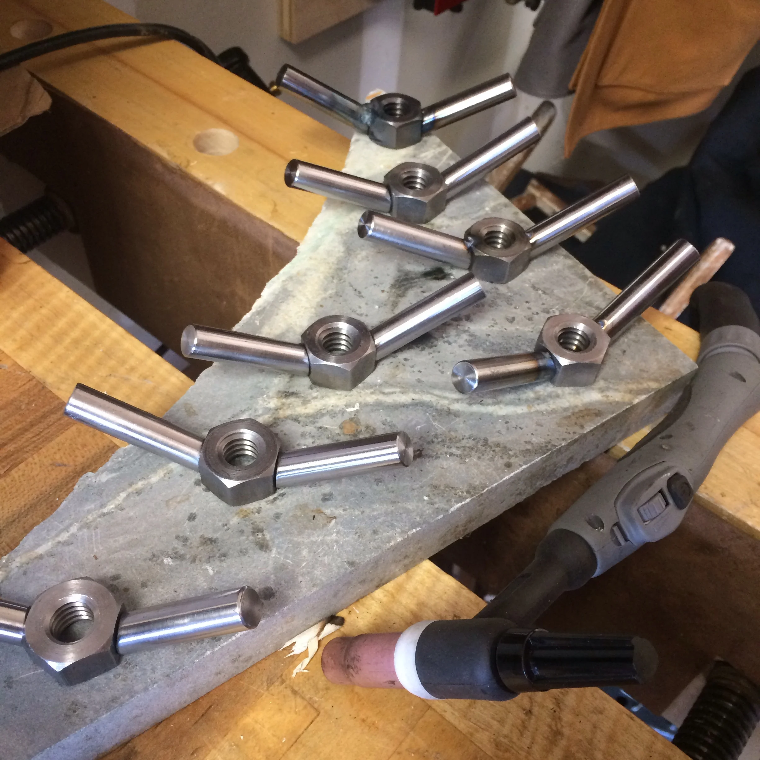 Wing nuts tacked in place, ready for final welding