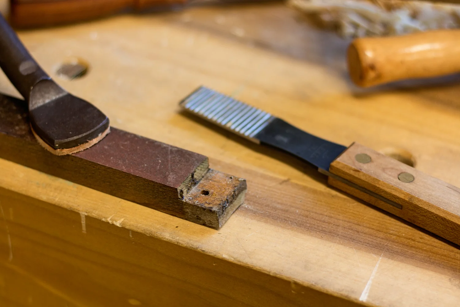 The next step in the Jaguar XK120 door frame restoration is the prepping of all factory joints for reassembly. All of the joints are covered in dried glue and dirt, a few swipes with a sharp planemaker's float takes care of the detritus quickly and efficiently.