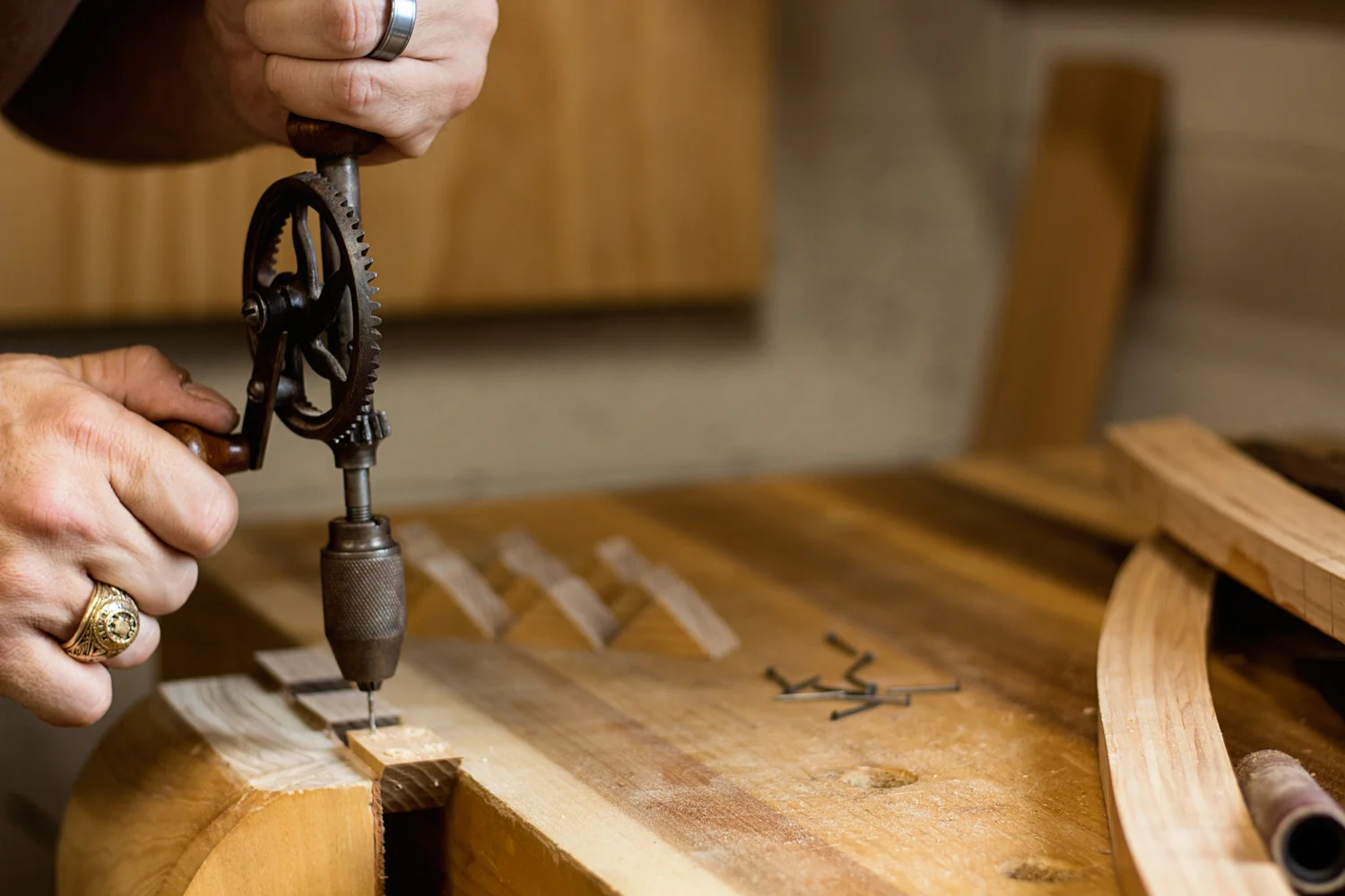 Every intersection between a runner and lateral support is strengthened with support blocks on all four sides. The blocks are nailed and glued in place. The old ones fell apart when removing them so I made some more this morning out of Ash. I can clamp up three at a time in my leg vise, allowing me to drill four pilot holes in each block for the nails. This little no-name hand drill is a workhorse in my shop, drilling all of my pilot holes on all of my projects without skipping a beat.
