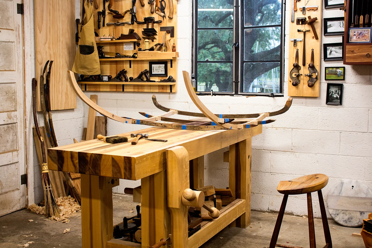 The inner portion of the Jaguar XK120 rear support structure is together. To make it easier to work on such a large piece, I turned my bench so that its perpendicular to the wall. Now I can walk around it and move it around with ease. And it really takes advantage of the natural light from the window.