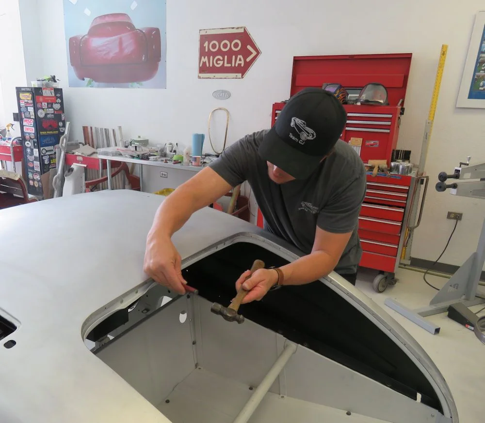 Securing the skin with the first of many panel nails