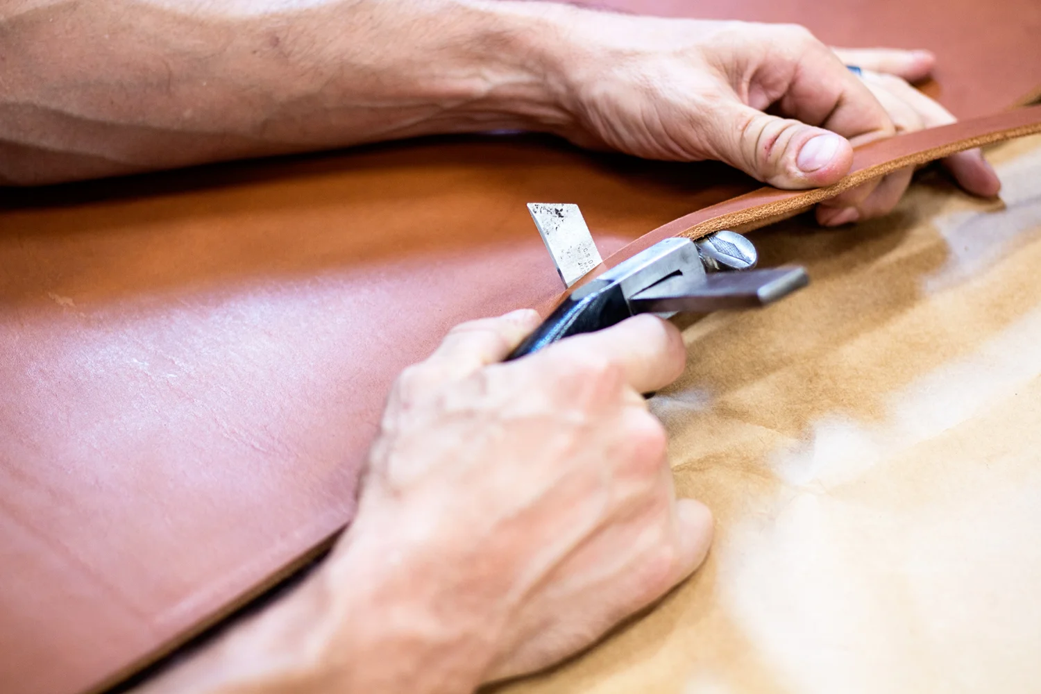 Each strip of leather is cut by hand, one at a time. No machines here!