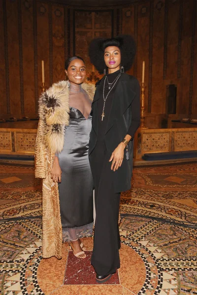 Tierra Benton and Denee Benton attending the Dennis Basso NYFW show both wearing accessories by Taunya Benton .