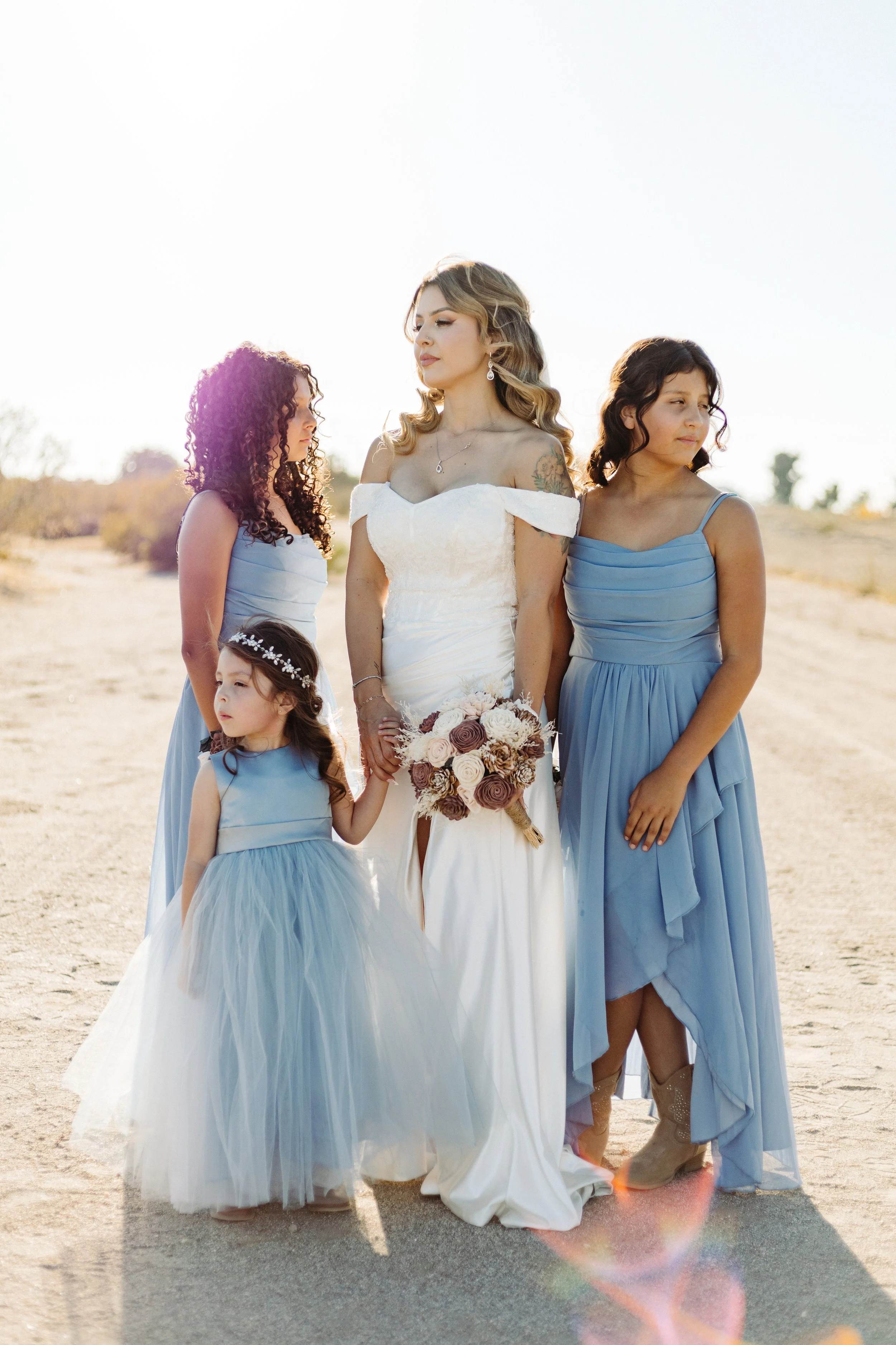 Beautiful bride with her girls in desert wedding in Phelan, CA
