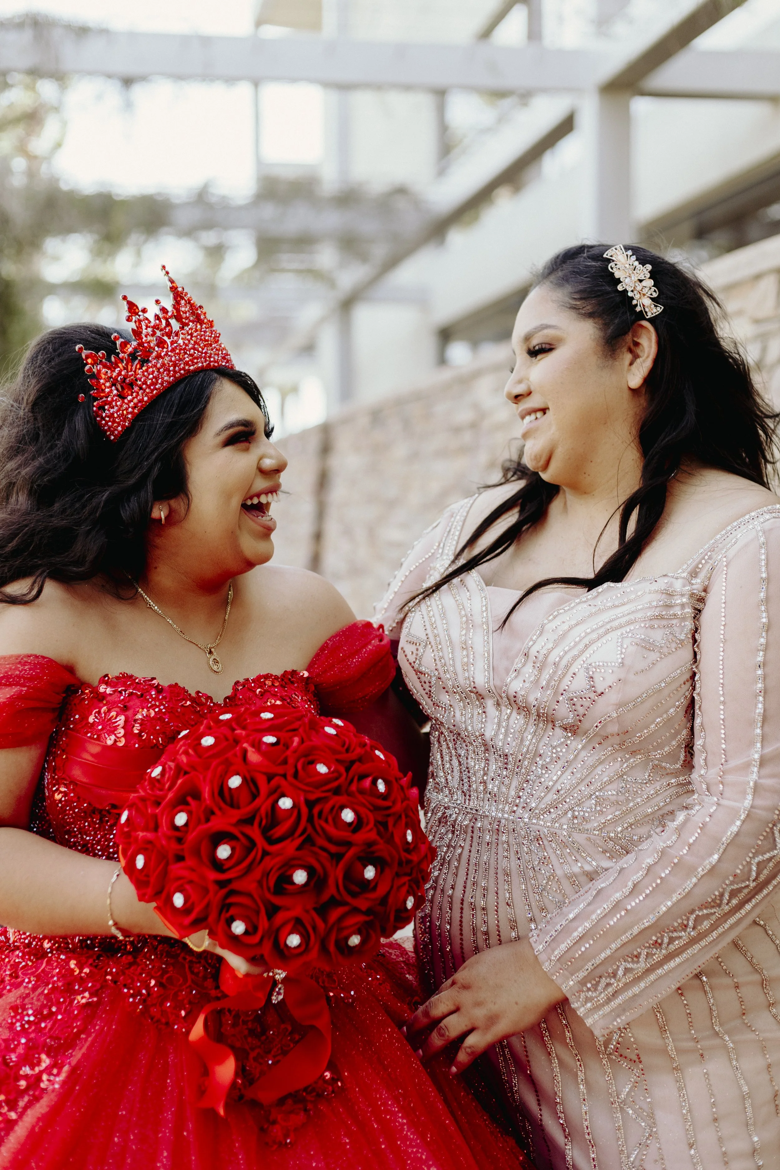 Quinceañera and her mother sharing a joyful moment together