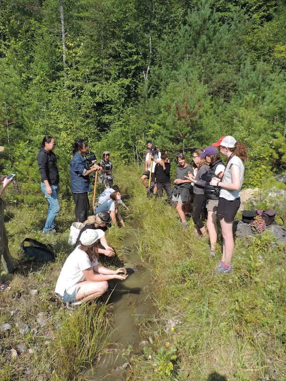 Workshop participants collecting silty clay from a creek in Dorset, VT