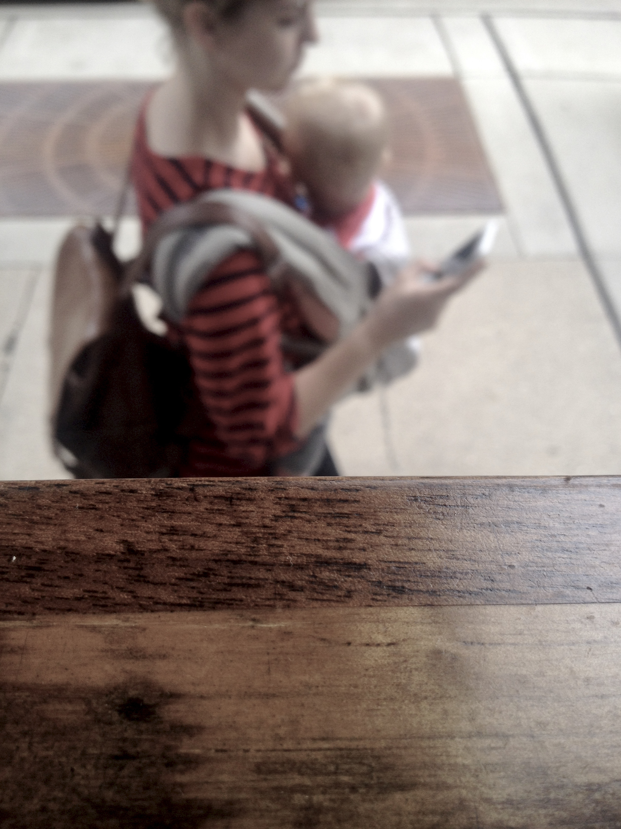Baby Wearer No. 1. A Coffee Shop Window. Madison, Wisconsin. October 2016. © William D. Walker