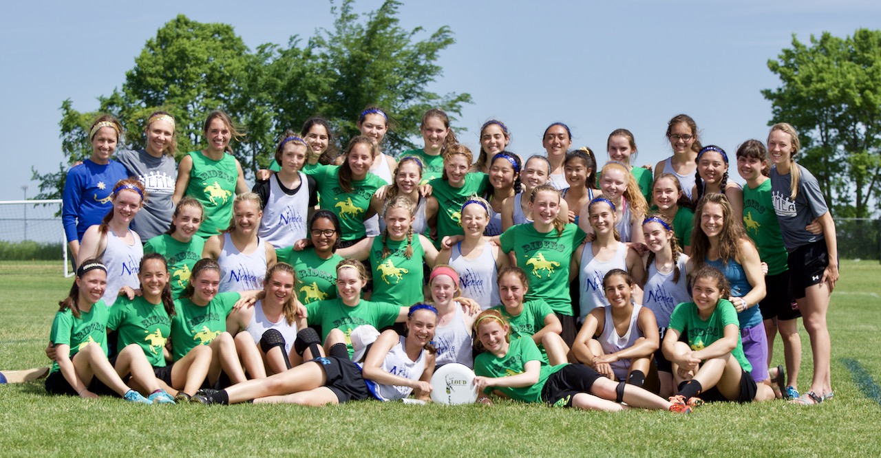 Kelly Donovan Commemoration. Sportscore Two. Loves Park, Illinois. June 2017. Roosevelt (Rough Riders) and Madison West (Nemea) Girls Ultimate Teams pose with a Kelly Donovan Award disc to commemorate Kelly's connections to Madison and Seattle. The teams played one another at the inaugural High School National Invite ultimate tournament. © William D. Walker 