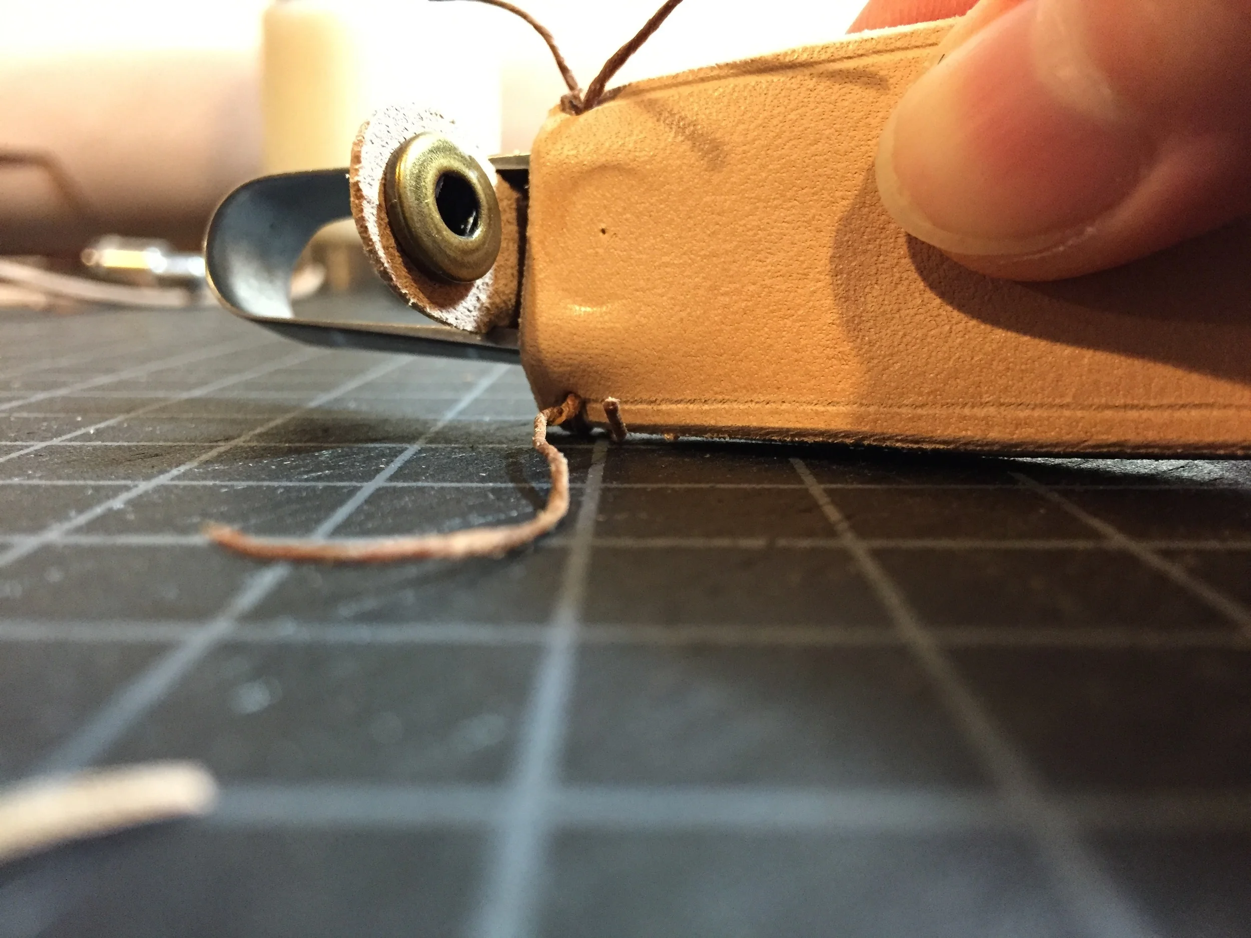Checking to see where the bottom part of the snap should be placed.