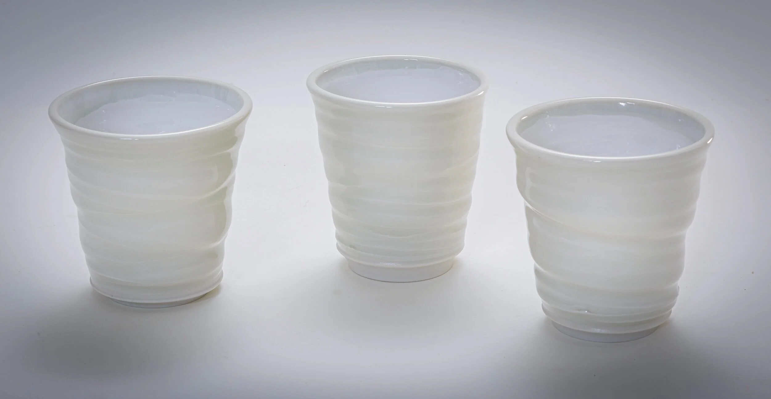  8 oz “Swirly” Tumblers: gloss white glaze on porcelain 