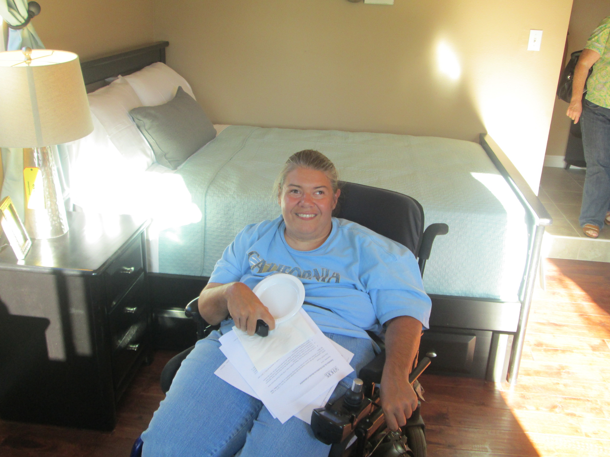 HRC Client Shauna takes a tour of the wheelchair accessible home. 