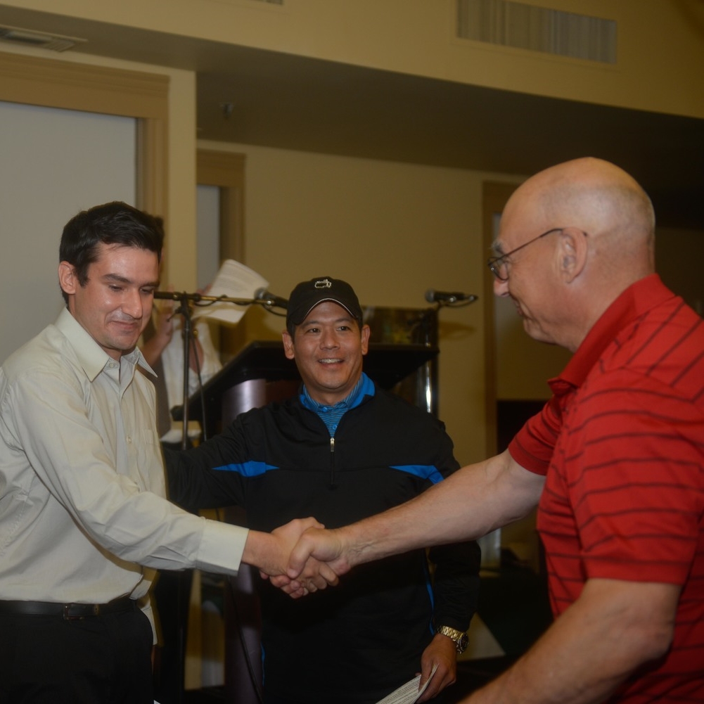 HOPE Board President Bob Irlen congratulates Sam while Rob Fukuzaki looks on. 