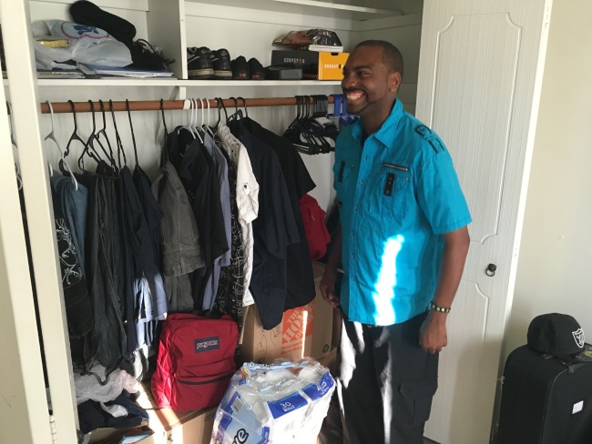 Brandon unpacking his belongings at his new HOPE home in Long Beach.