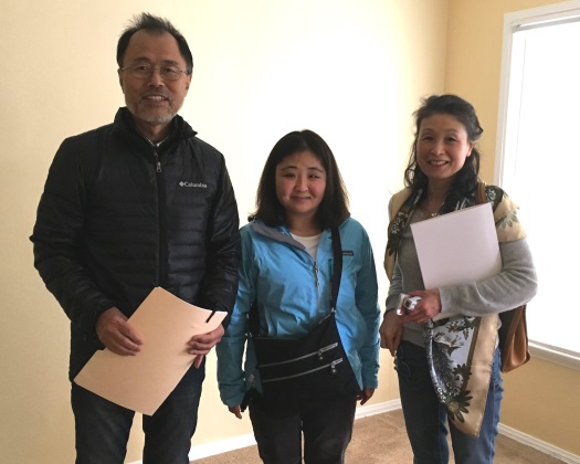 Newest HOPE resident Hazuki Kobayashi (center) with parents as she moves into her first apartment at Banner.