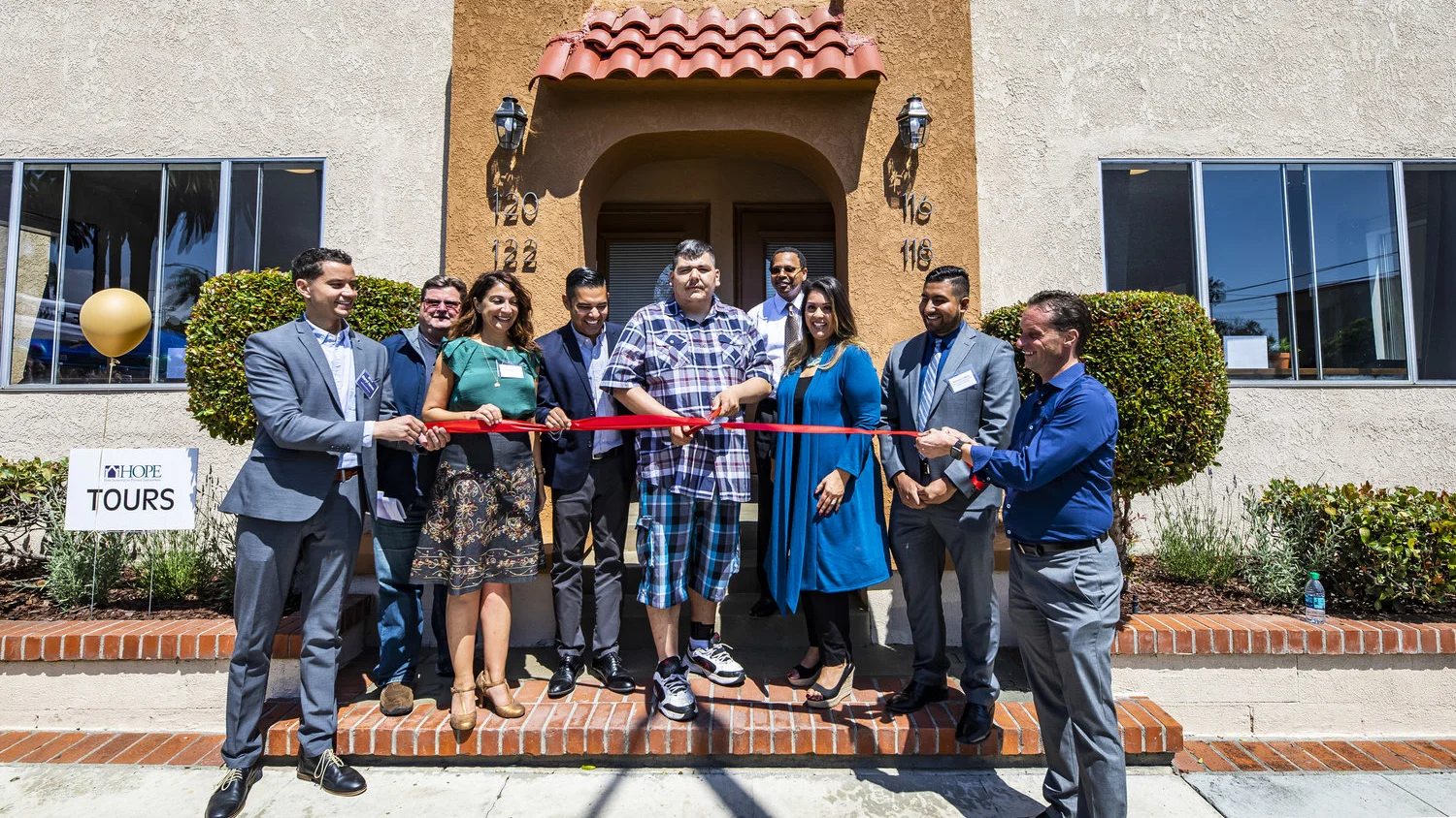 From left: Daryl James, John Thomas, Councilwoman Suzie Price, Mayor Robert Garcia, Joe Ramirez, Derrick Mims, Herlinda Chico, Nicholas Cabeza, and Kristin Martin. (HOPE)