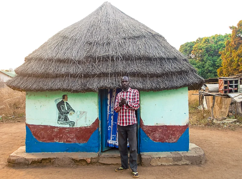 Makonis Billi in front of his house