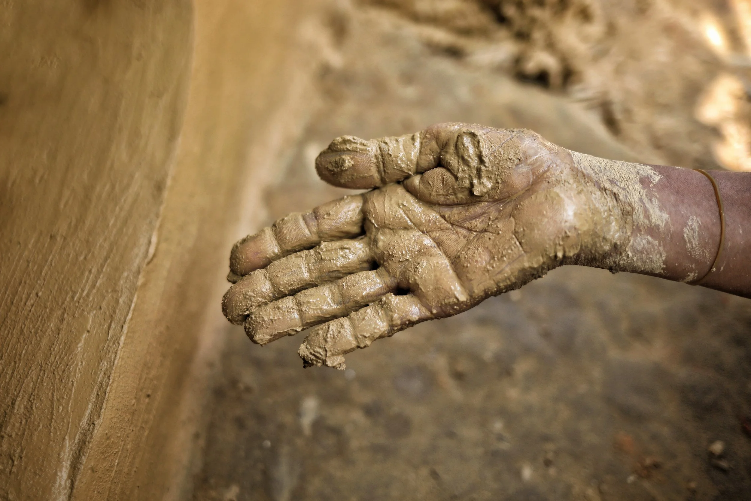 A Rohingya refugee overlaps her home with mud to repair the cracked areas of her home, one that is primarily constructed of mud. Photo by Nihab Rahman . All other photos by Scott J. Will.