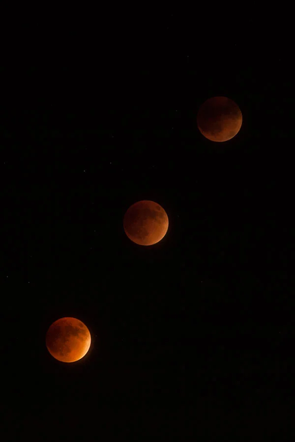 Blood Moon Supermoon Lunar Eclipse: succession of 3 shots as the red-tinted moon rose in the air. September 27, 2015.