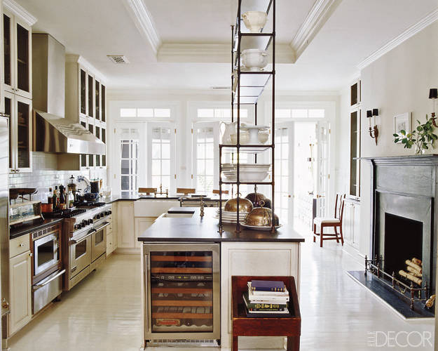 This kitchen..... WOW. Complete with a wine fridge and an antique italian étagère.