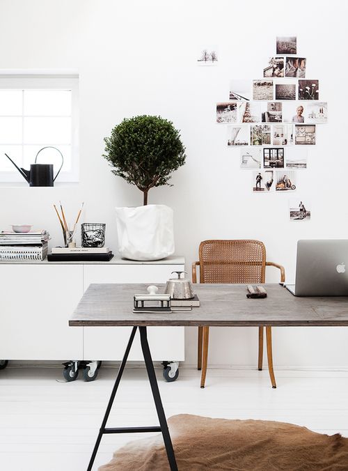 One of my all time favourite office spaces. I personally have a desk almost identical to this (I purchased the treacle legs from Ikea and a raw pine timber top from Bunnings!) A cowhide rug provides another layer and i just love love love the mini tree and inspiring images on the wall. Essentials such as the watering can and paint brushes are easily accessible as well as being used as part of the styling in the space.