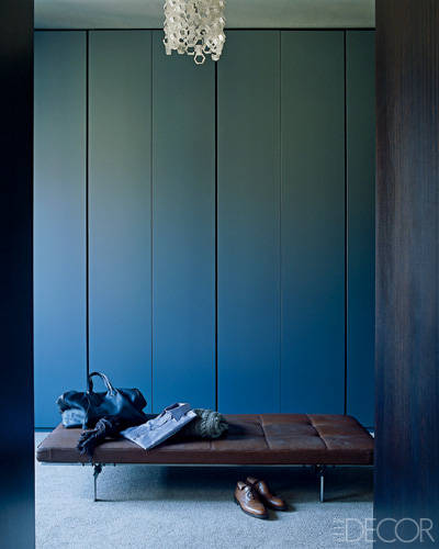 The dressing room features a daybed by Poul Kjaerholm