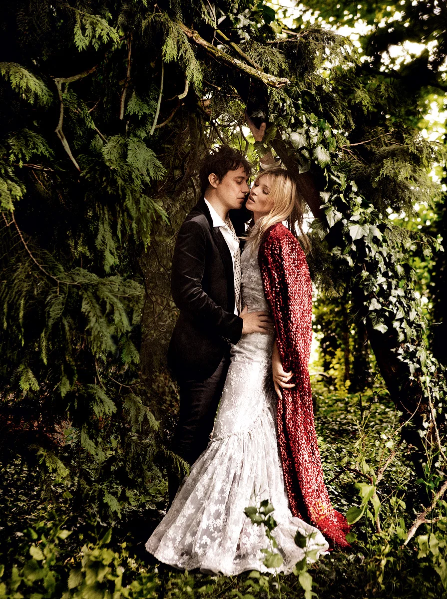The newlyweds bring a bit of the Roaring ’20s to the bucolic English countryside. Rodarte paillette coat and beaded lace dress. Jamie wears Lanvin velvet blaze