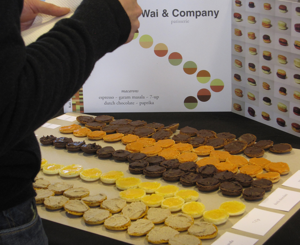 Wai & Company is a service concept prototyped at Design Academy Eindhoven, to transform a cold transactional interaction into a social exchange. The typology of the macaron, a French cookie with two halves, is the platform for sharing. Instead of receiving a macaron with just the flavor of your choosing, half of your macaron is from the customer in front of you. Your chosen flavor in turns becomes half of the customer after you.