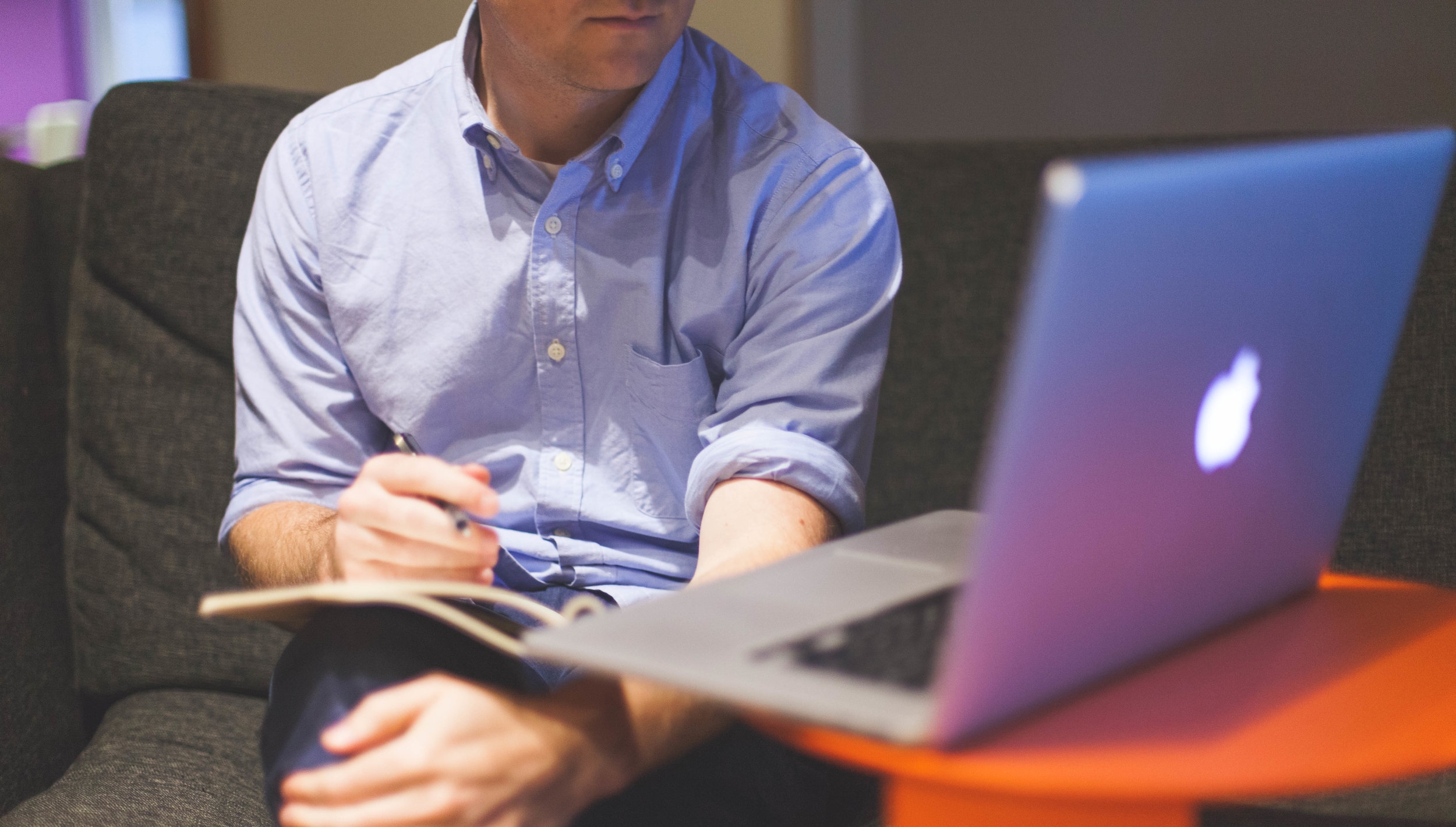 man-notes-macbook-computer.jpg